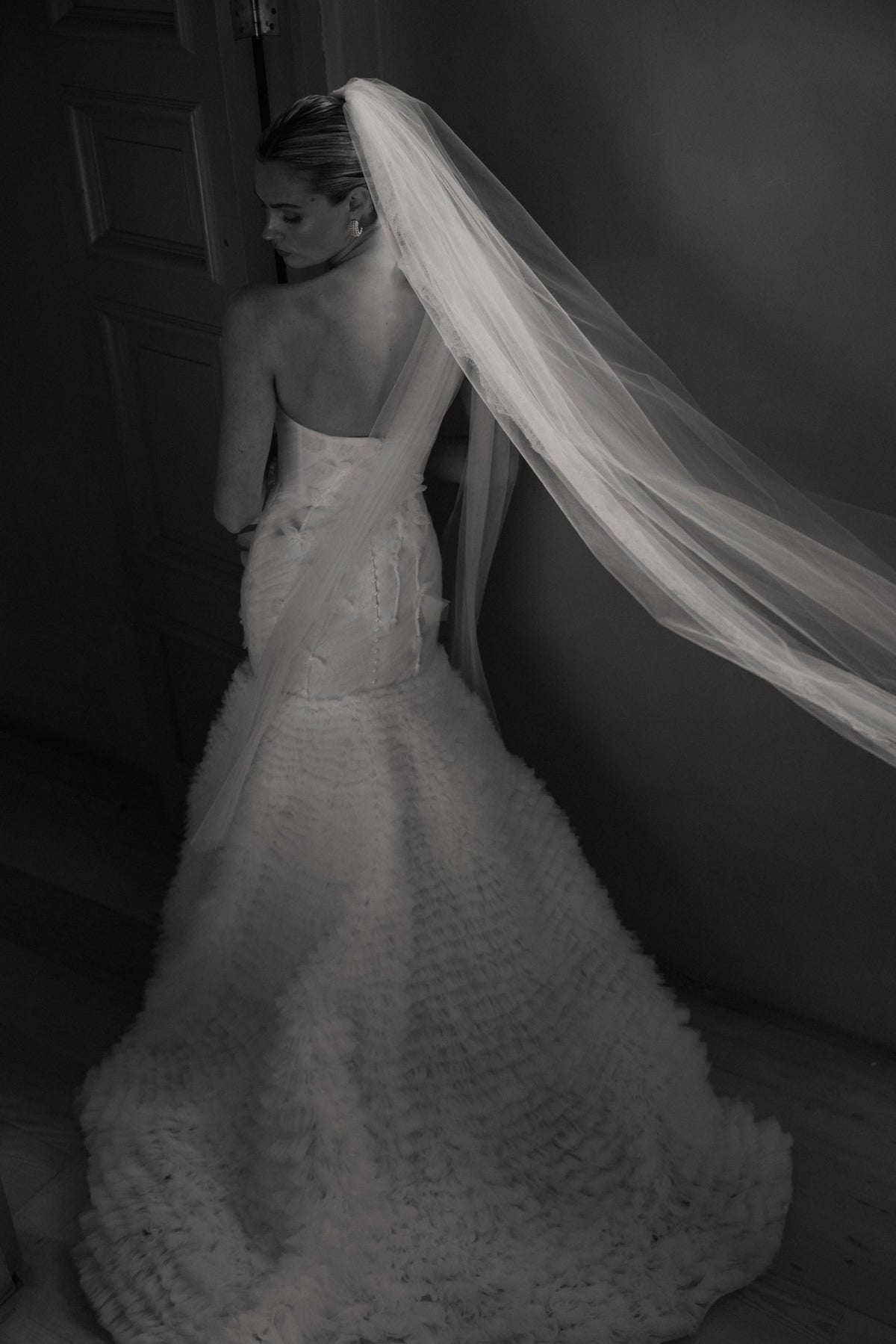 A bride in an AW/26 Luminaire gown