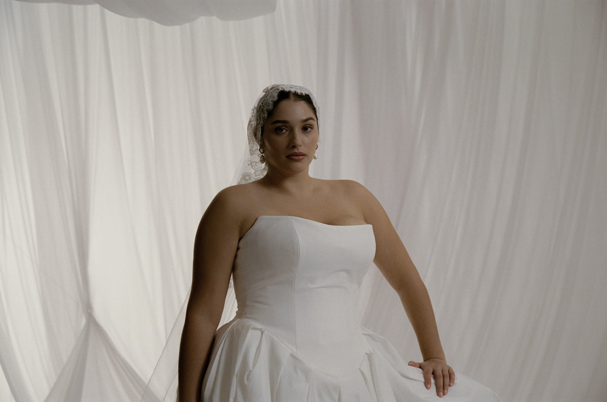 AW/27 Defiant Renaissance - strapless gown against draped silk