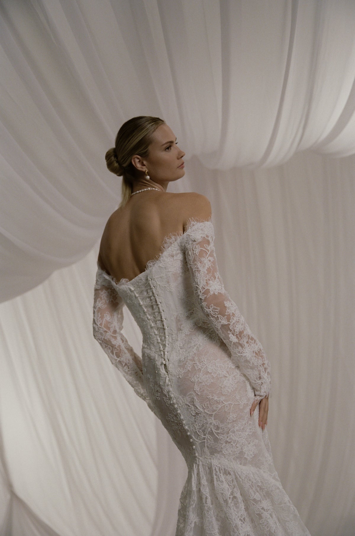 AW/27 Defiant Renaissance - bride in a lace-trimmed veil