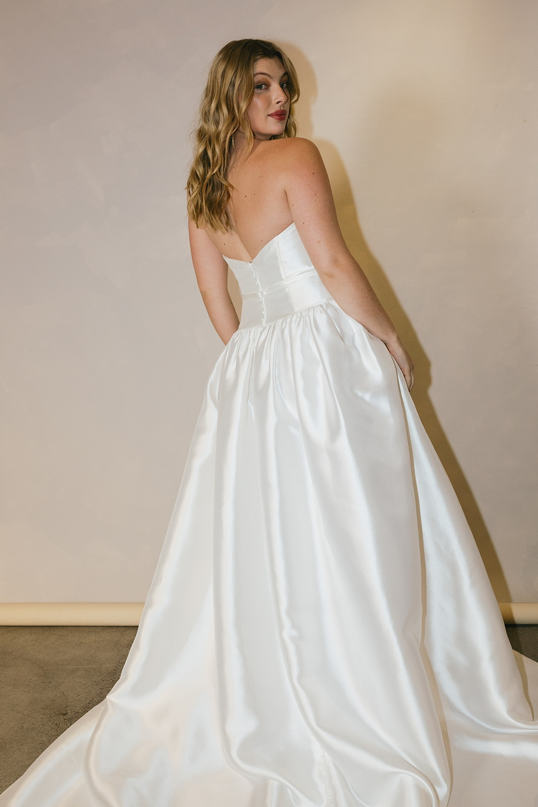 Evergreen Collection - bride in a fitted gown with a soft train