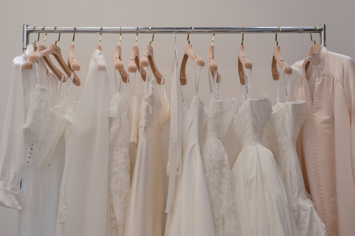 A rail of Hera Couture gowns at a stockist