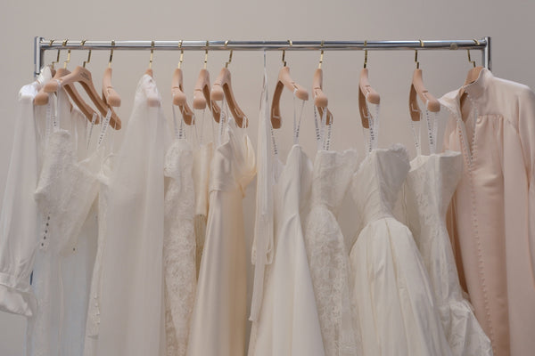 A rail of Hera Couture gowns at a stockist