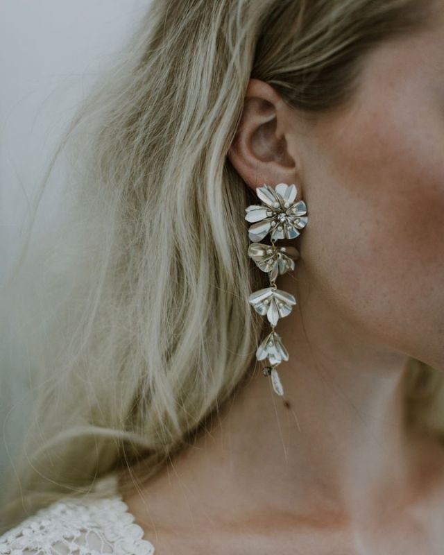 Metal petals with Rhinestone Accents | the beautiful Elysee tiered earrings available in our showroom ✨